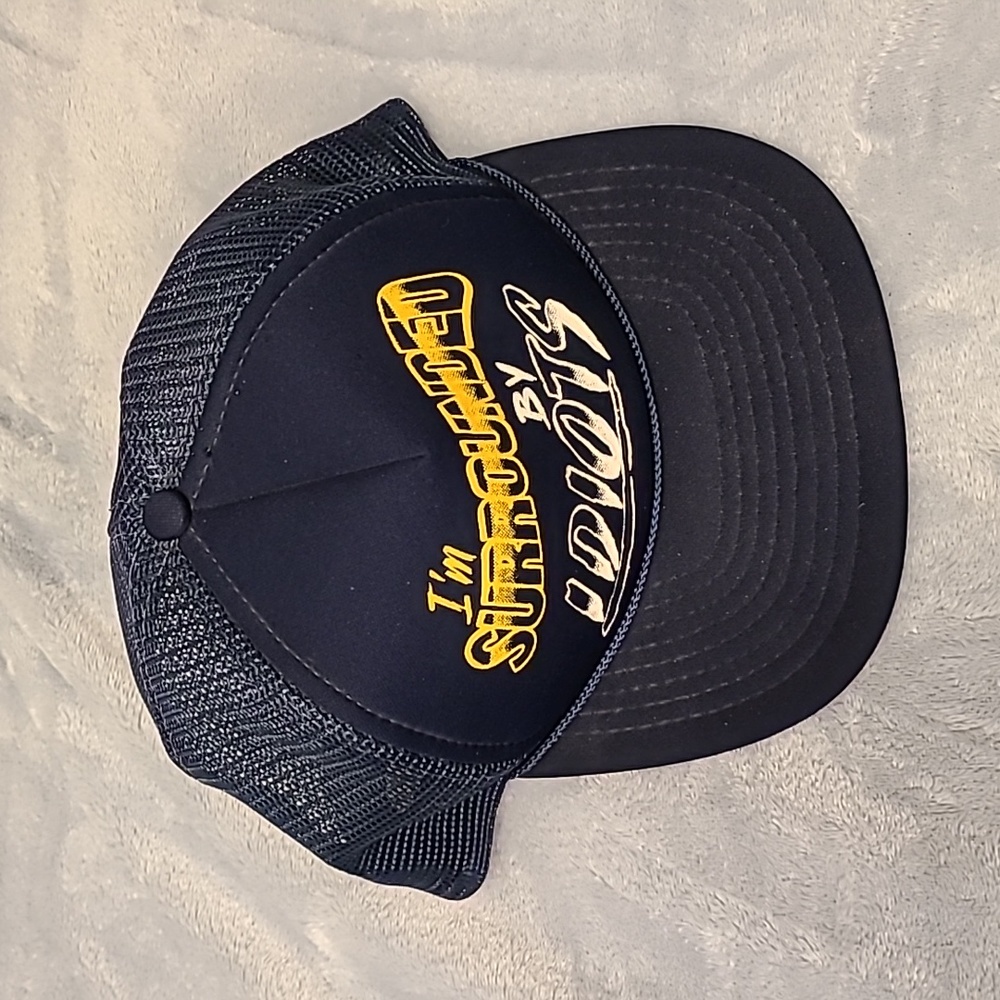 "Surrounded by idiots" trucker hat